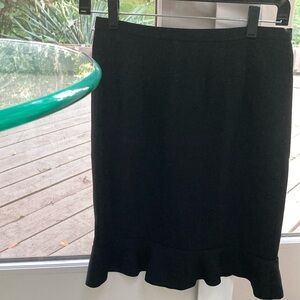 Skirt w/Ruffles on bottom. Black. Brand New. Size 4. Neiman Marcus label.